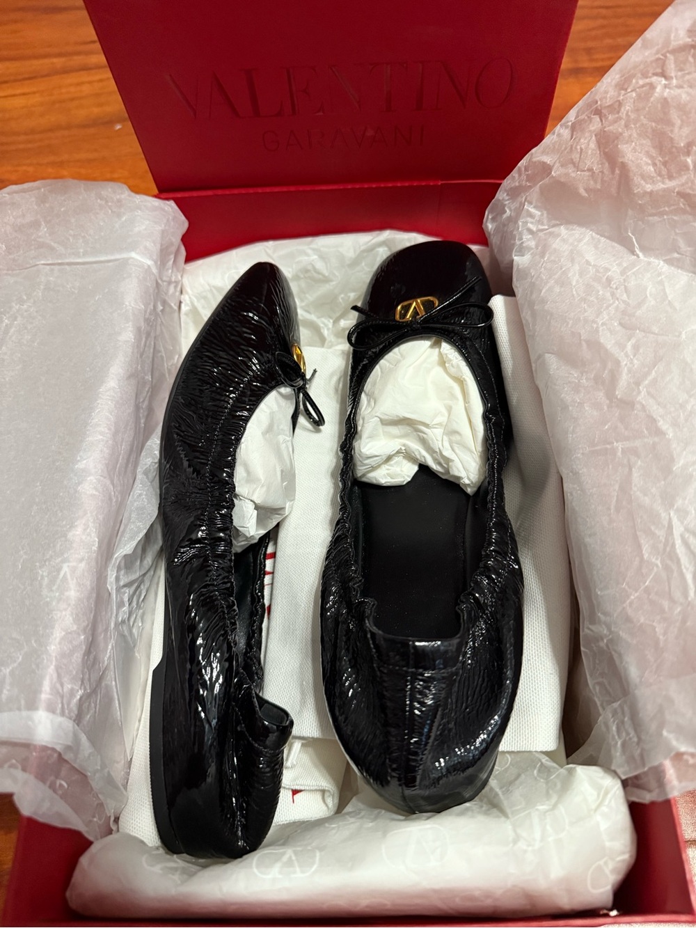 Valentino Garavani Black Patent Leather Ballet Flats with Gold Logo
